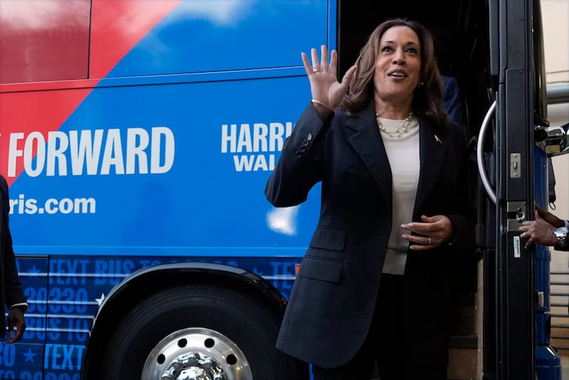 Kamala Harris waves as she exits her campaign bus in Savannah, Georgia (Jacquelyn Martin/AP)