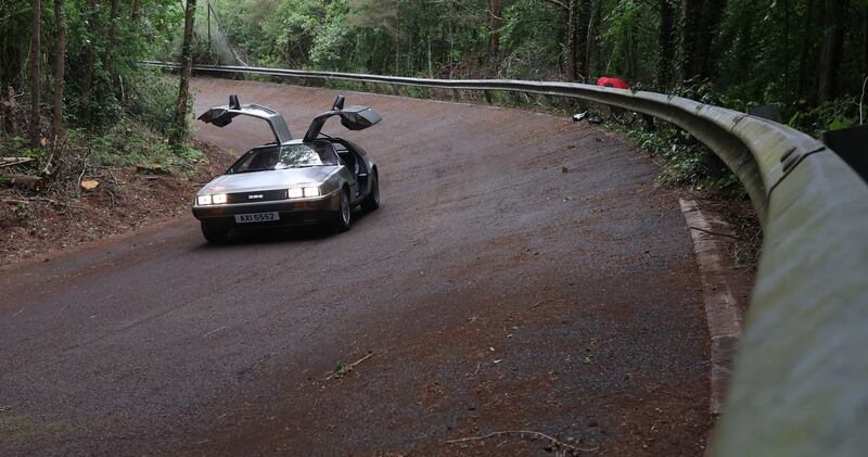 DeLorean owners gather at the Cutts in Dunmurry on Sunday as they drive on the old test track as part of the DeLorean Revival in Belfast.
PICTURE COLM LENAGHAN