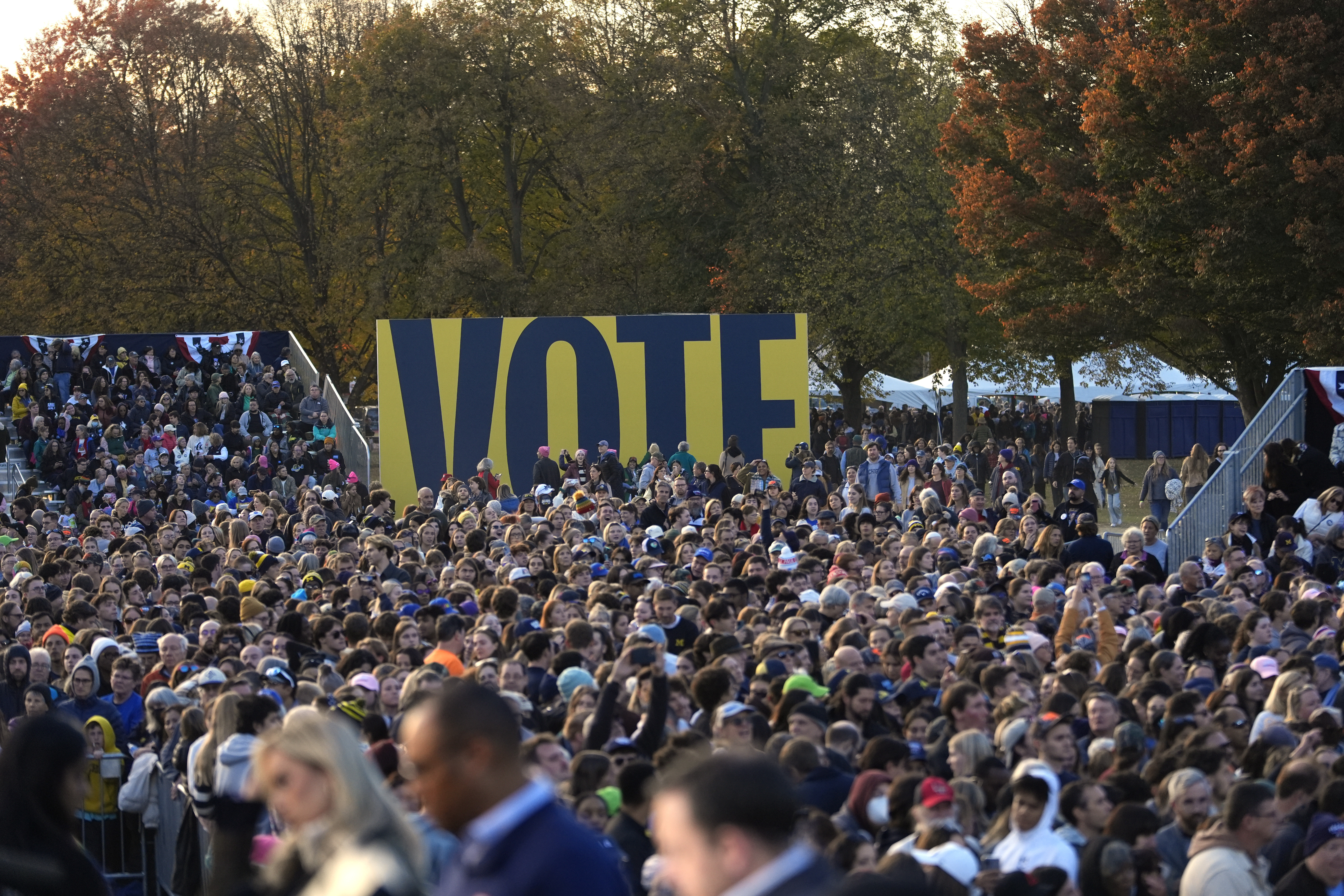 A crowd waits before US Vice President Kamala Harris arrives to speak during a campaign rally at Burns Park in Ann Arbor, Michigan (Carlos Osorio/AP)