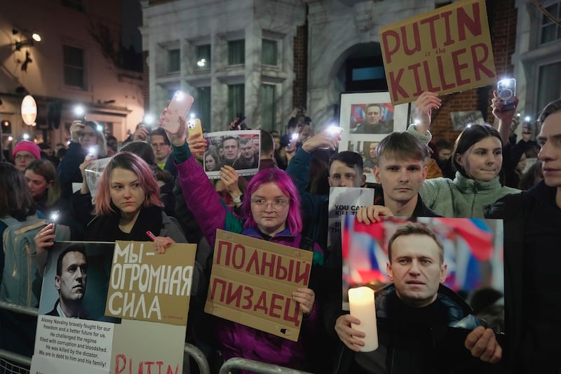 Protesters stage a demonstration opposite the Russian Embassy in London (AP Photo/Kin Cheung)