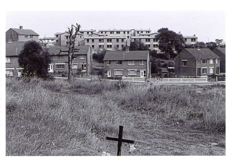 The spot where Fr Hugh Mullan and Frank Quinn were shot. Fr Mullan&#39;s house is to the left of the white fence with the shots thought to have come from the flats behind it 