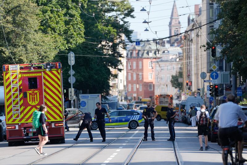 Police officers block a street after the incident in Munich (Matthias Schrader/AP)