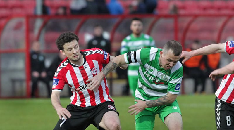 Derry City's Barry McNamee with Gary McCabe of Shamrock Rovers at the Brandywell on Friday night. Picture: Margaret McLaughlin