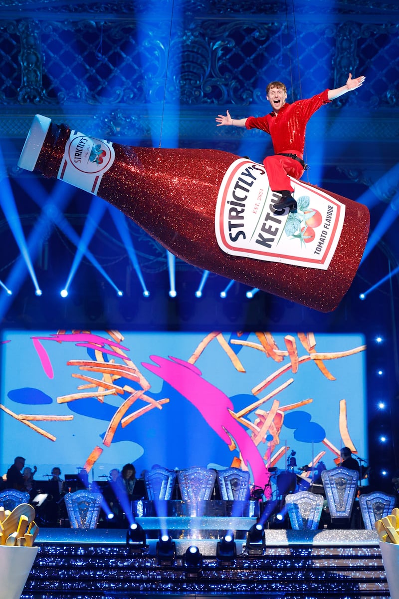 Jamie Borthwick sitting astride the ketchup bottle prop