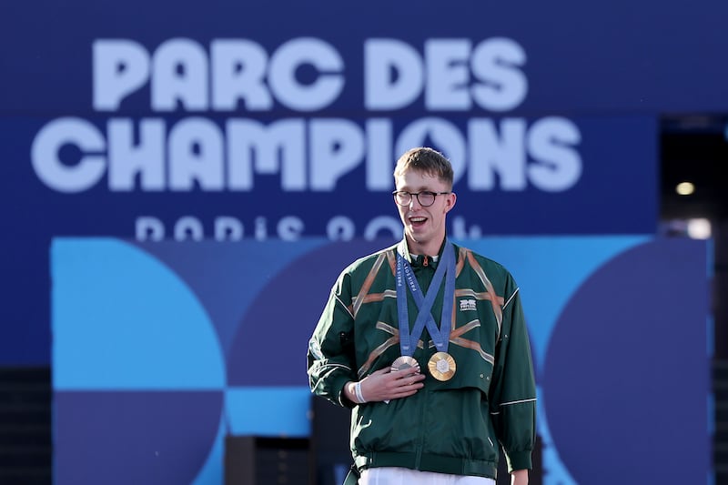 Daniel Wiffen enjoyed parading his medals at Monday night's Champions' Walk at the Parc des Champions in Paris. Photo by Arturo Holmes/Getty Images