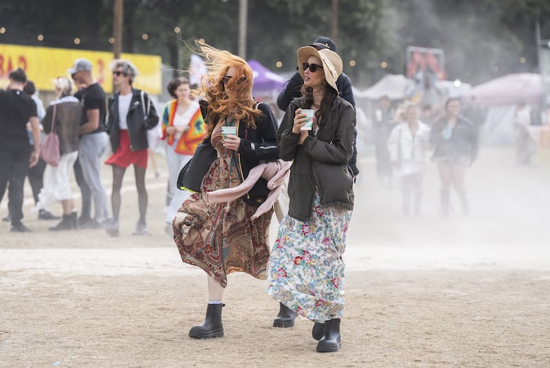 People in windy conditions during the Leeds Festival 2024 at Bramham Park