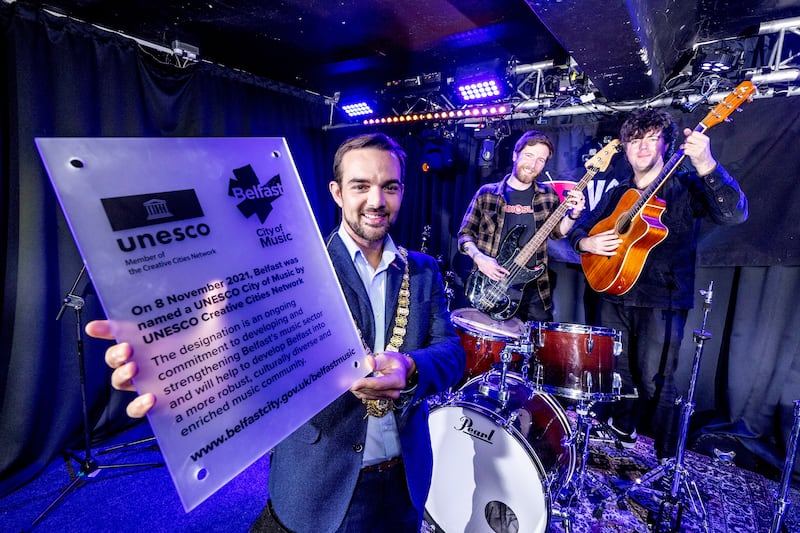 Lord Mayor of Belfast Micky Murray wth Ruairi Moynagh from Voodoo Belfast (left) and Brian Coney from Belfast Region Music Board (right)