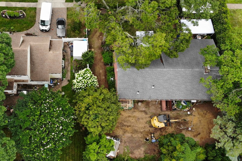 Investigators at Rex Heuermann’s home in Massapequa Park (Seth Wenig/AP)