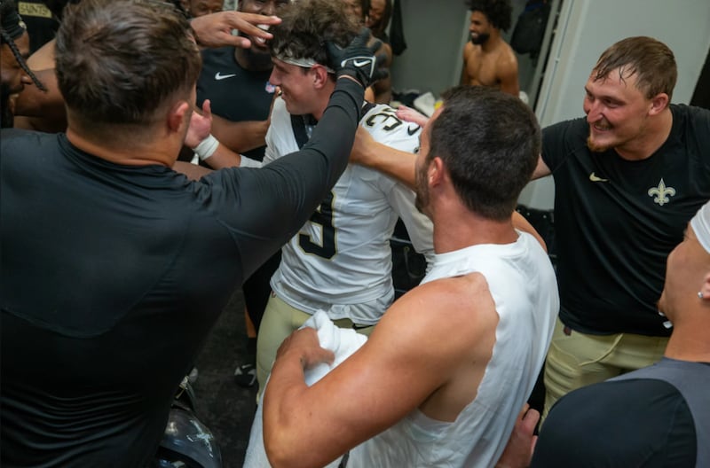 Charlie Symth getting congratulated on his game-winning field goal which earned him the gameball, which is presented by the head coach to the player of the match. PICTURE: Layne Murdoch Jr