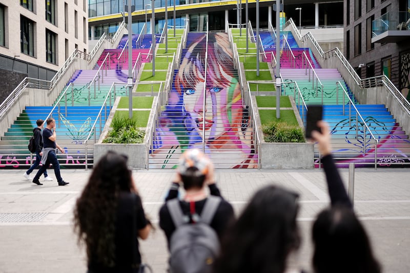 A mural of Taylor Swift outside Wembley Stadium in London in June. The ‘Swift lift’ is expected to have brought a boost to spending