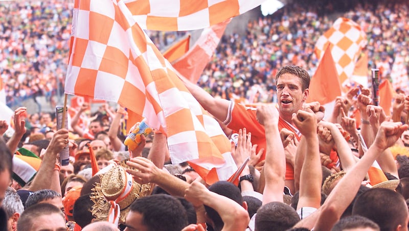 Armagh captain Kieran McGeeney is carried shoulder-high off the Croke Park pitch after the All-Ireland final win over Kerry in 2002, an era when fans knew more about players and any little bit of needle between teams was public knowledge. Picture: Ann McManus