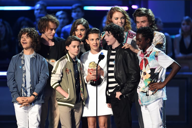 (left to right) Actors Gaten Matarazzo, Charlie Heaton, Noah Schnapp, Natalia Dyer, Shannon Purser, Millie Bobby Brown, Finn Wolfhard, Joe Keery, and Caleb McLaughlin