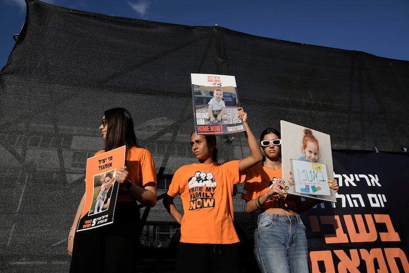 Family, friends and supporters of Ariel Bibas, who is held hostage by Hamas in the Gaza Strip, mark his fifth birthday in Tel Aviv (Mahmoud Illean/AP)