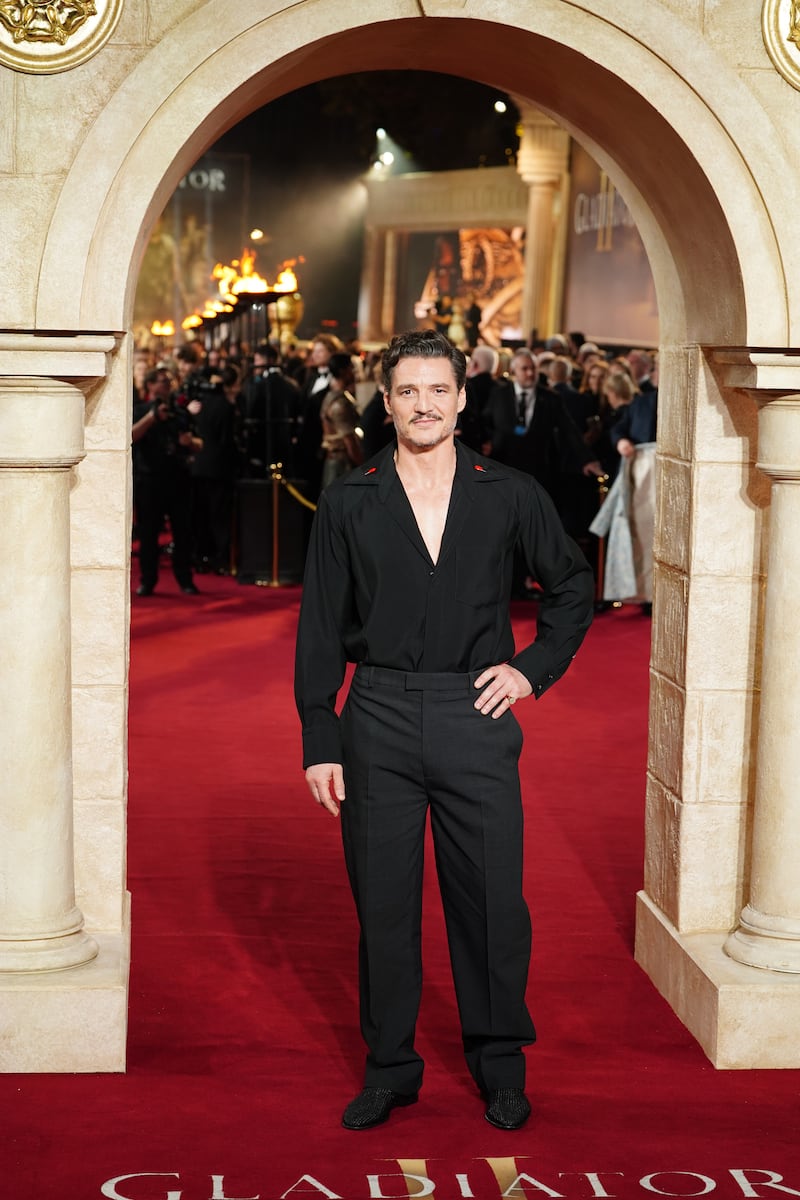 Pedro Pascal went all black in an open collar black shirt