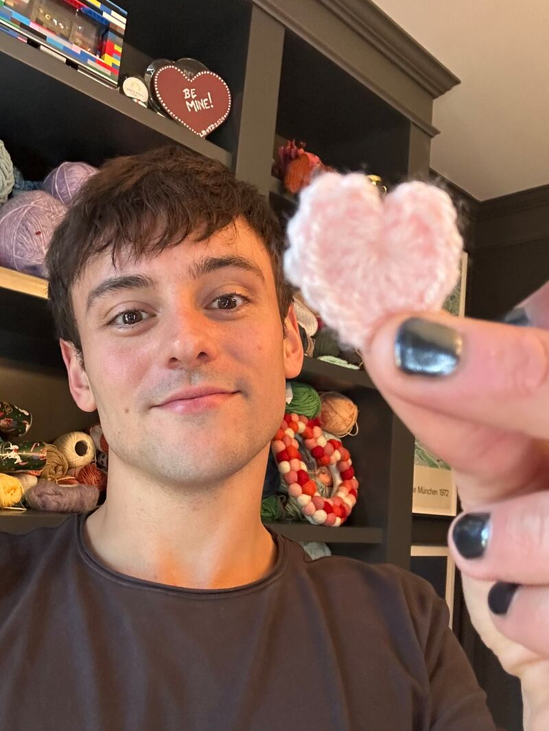 Tom Daley has crocheted several pink hearts for Tracey Howe