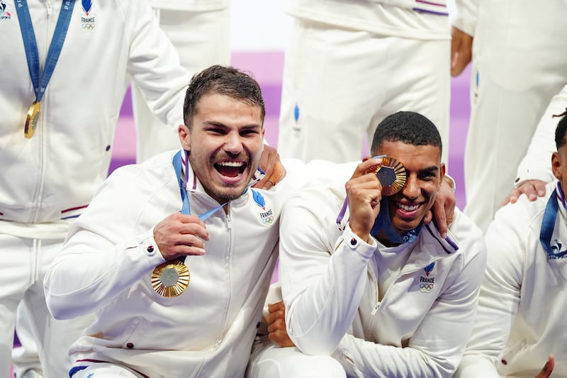 France's Antoine Dupont and Aaron Grandidier Nkanang after winning the rugby sevens gold medal match at the Stade de France on the first day of the 2024 Paris Olympic Games in France. Picture: Mike Egerton/PA Wire.