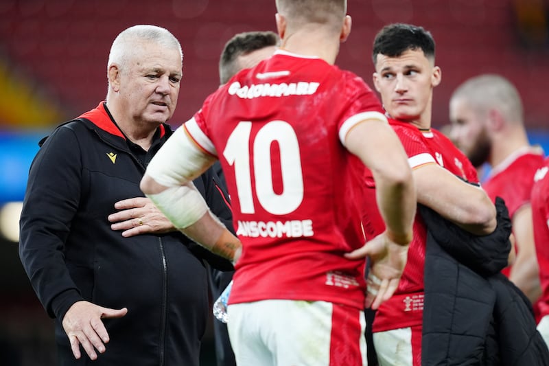 Warren Gatland (left) consoles his players at the end of the game