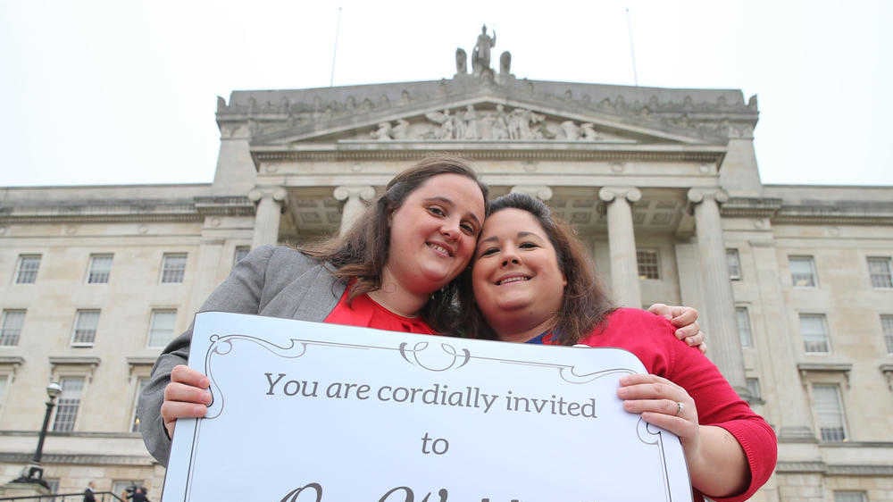 Same sex couple Jayne Robinson (left) and Laura McKee at Stormont on Monday with an open invitation to their wedding if MLAs vote to legalise same-sex marriage