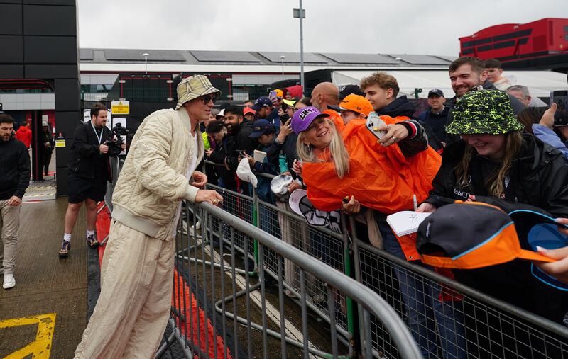 Brad Pitt arrives ahead of practice 3 of the British Grand Prix at Silverstone Circuit