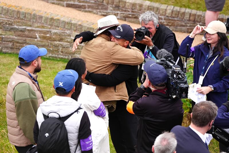 Xander Schauffele celebrates with his father Stefan after winning the 152nd Open at Royal Troon