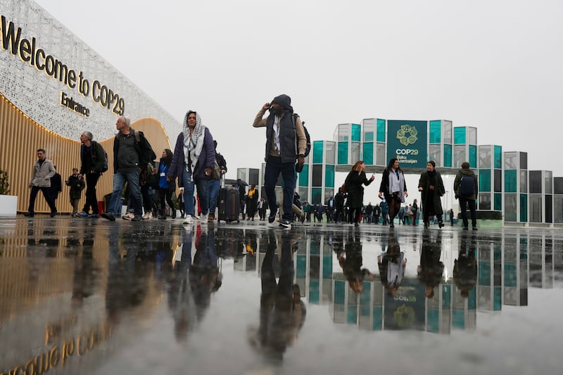 People arriving at the venue for Cop29 in Baku, Azerbaijan (AP Photo/Rafiq Maqbool)