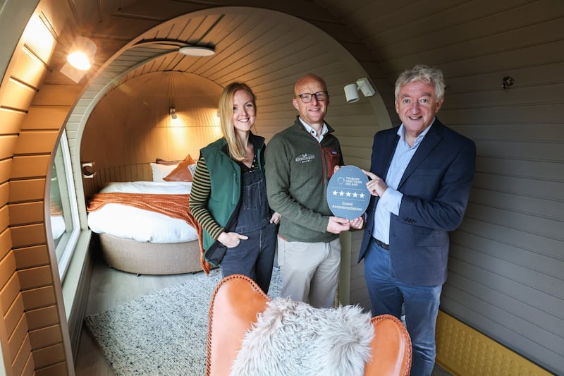 John McGrillen (right), CEO of Tourism Northern Ireland, pictured with Esme Porter and Andrew Porter, owners of Enniskeen Estate in Newcastle, which has been awarded a five-star accommodation grading by Tourism NI. PICTURE: TOURISM NI