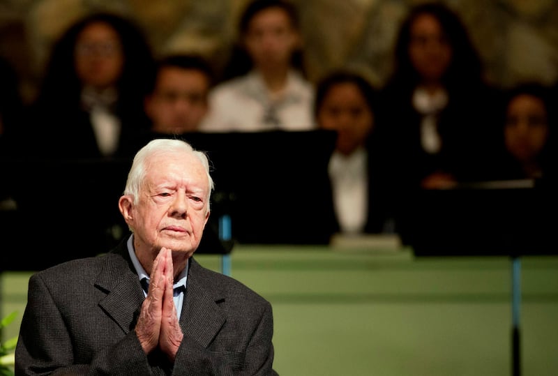 FILE – Former President Jimmy Carter teaches Sunday school class at Maranatha Baptist Church in his hometown, Aug. 23, 2015, in Plains, Ga. The 90-year-old Carter gave one lesson to about 300 people filling the small Baptist church that he and his wife, Rosalynn, attend. It was Carter’s first lesson since detailing the intravenous drug doses and radiation treatment planned to treat melanoma found in his brain after surgery to remove a tumor from his liver. (AP Photo/David Goldman, File)