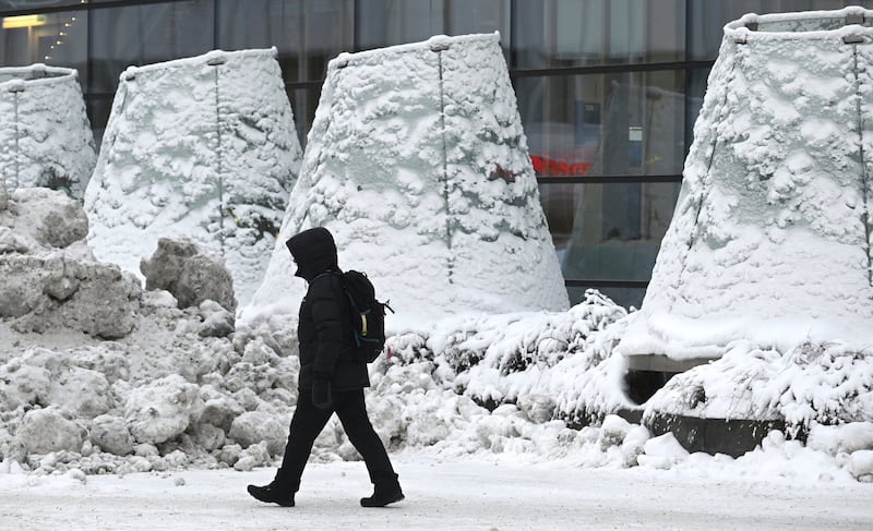 A man walks through Helsinki in Finland in freezing temperatures (Heikki Saukkomaa/Lehtikuva/AP)