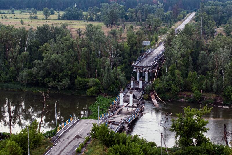 A destroyed bridge across Siverskyi-Donets river in Ukraine (Evgeniy Maloletka/AP)