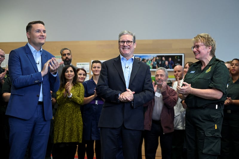 Prime Minister Sir Keir Starmer and Health Secretary Wes Streeting with London Ambulance Service chief paramedic Pauline Cranmer in east London