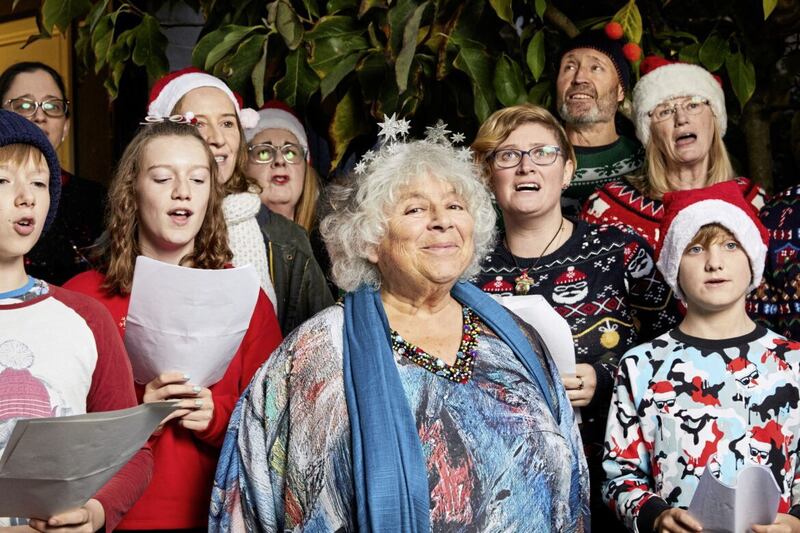 Miriam Margolyes with a group of carollers, as part of her extensive festive-related research for her Charles Dickens-based Christmas TV special 