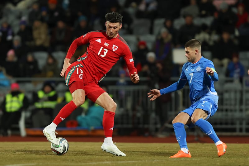 Wales striker Kieffer Moore takes on Iceland’s Johann Berg Gudmundsson in their Nations League draw (Arni Torfason/AP)