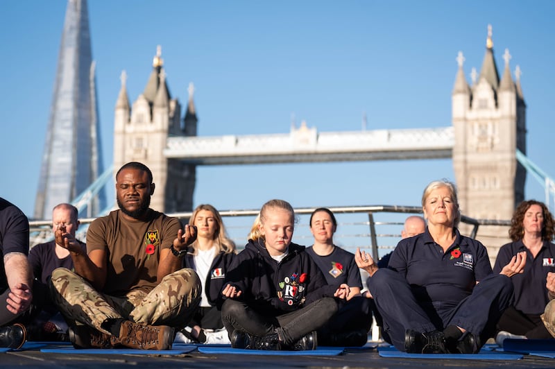 Ruby Sheffield (centre) took part in a mindfulness session with service personnel and veterans at St Katharine Docks Marina in London