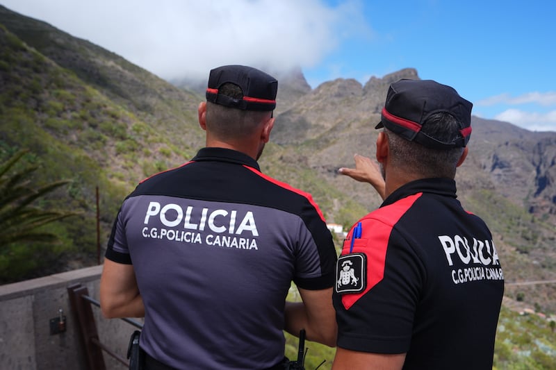 Police officers overlook the village of Masca, Tenerife, during the search for missing British teenager Jay Slater, 19, from Oswaldtwistle, Lancashire