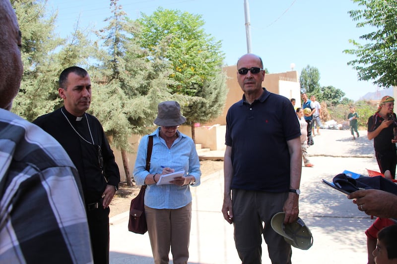 Regina Lynch visiting Christians internally-displaced in the city of Mangesh, Kurdistan in the wake of the ISIS invasion with Dr Shimoun Nona, Chaldean Catholic Archbishop of Mosul. The city hosted dozens of Christian families, many of whom have now returned to newly-reconstructed homes