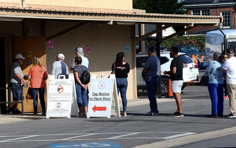 People began queuing to vote as more states opened early voting, to allow people to cast their votes before election day (Delcia Lopez/The Monitor via AP)