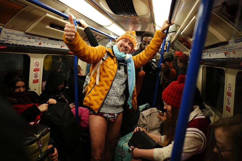 One man opted for a more cosy look with an orange puffer jacket, orange beanie and blue scarf