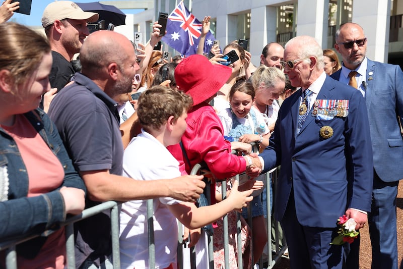 Charles meets members of the public during a walkabout outside Parliament House in Canberra