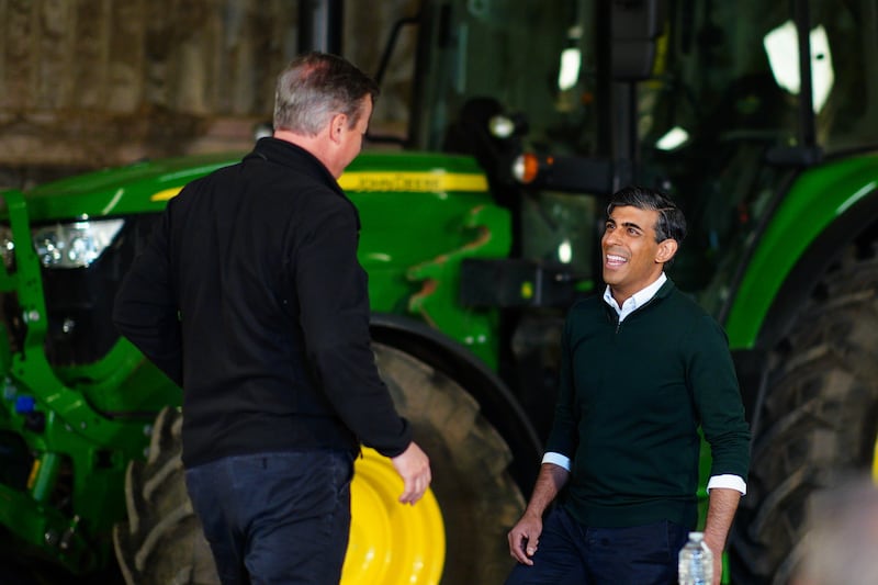 Foreign Secretary Lord David Cameron and Prime Minister Rishi Sunak on a farm visit during the campaign trail