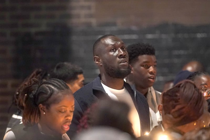 Stormzy (centre) joined a vigil in Croydon