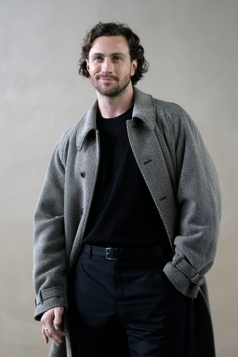 British actor Aaron Taylor-Johnson wore a herringbone-patterned coat (Luca Bruno/AP)