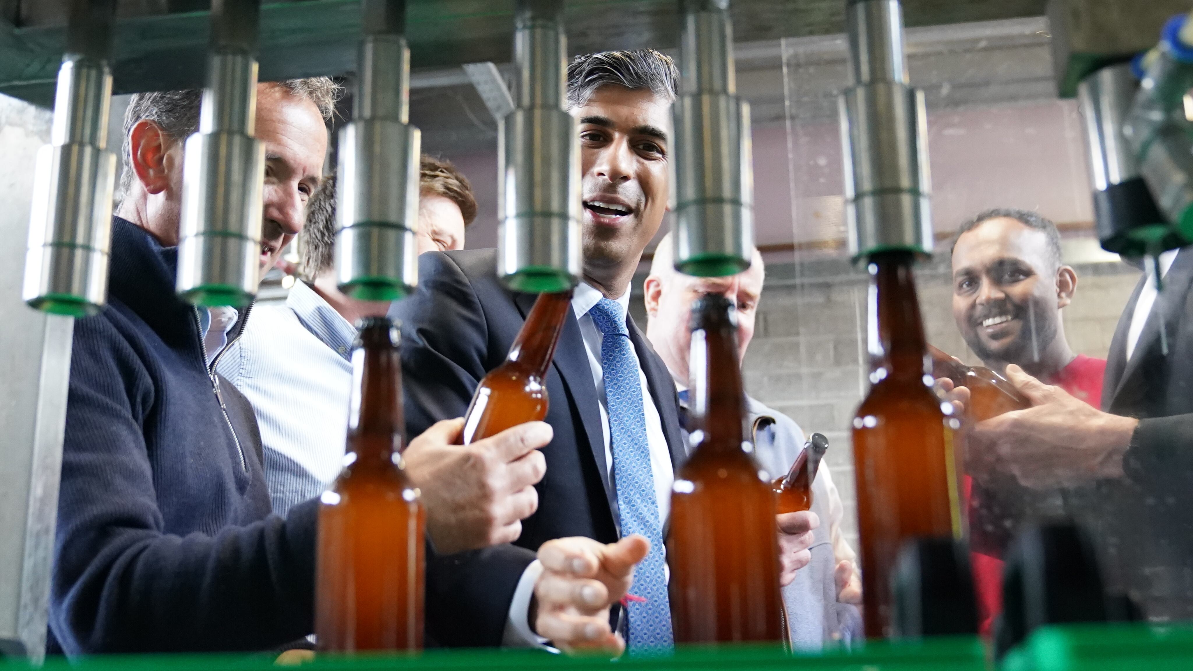 Prime Minister Rishi Sunak watching beer being bottled at the Vale of Glamorgan Brewery