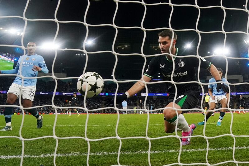 Santiago Gimenez, right, scores Feyenoord’s second goal