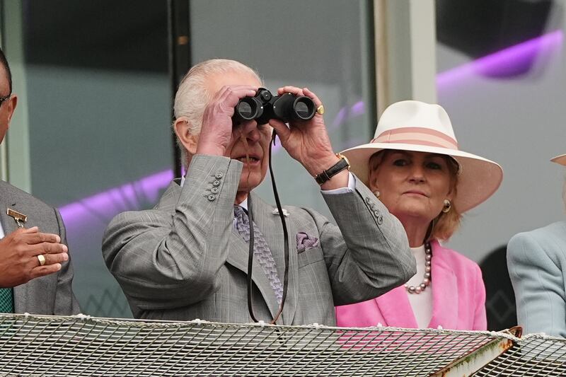 The King watches as horse Treasure races in The Oaks