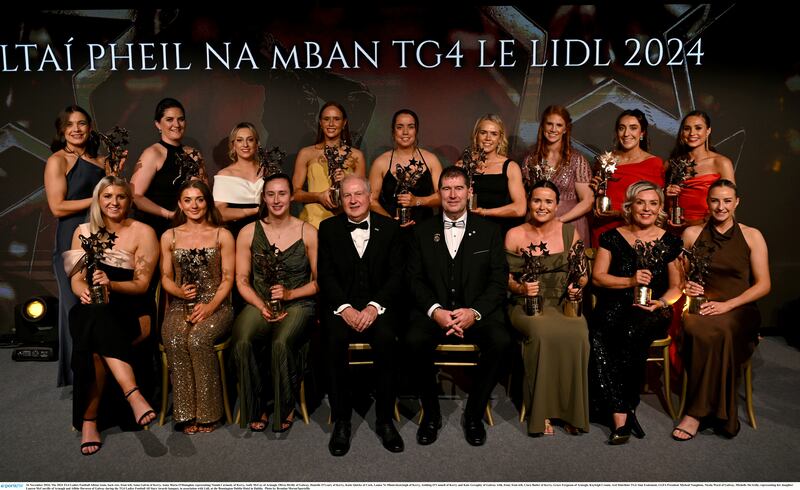 16 November 2024; The 2024 TG4 Ladies Football Allstar team, back row, from left, Anna Galvin of Kerry, Anna Maria O'Donoghue representing Niamh Carmody of Kerry, Aoife McCoy of Armagh, Olivia Divilly of Galway, Danielle OLeary of Kerry, Katie Quirke of Cork, Louise Ní Mhuircheartaigh of Kerry, Aishling OConnell of Kerry and Kate Geraghty of Galway with, front, from left, Ciara Butler of Kerry, Grace Ferguson of Armagh, Kayleigh Cronin, Ard Stiúrthóir TG4 Alan Esslemont, LGFA President Mícheál Naughton, Nicola Ward of Galway, Michelle McArdle, representing her daughter Lauren McConville of Armagh and Ailbhe Davoren of Galway during the TG4 Ladies Football All Stars Awards banquet, in association with Lidl, at the Bonnington Dublin Hotel in Dublin.  Photo by Brendan Moran/Sportsfile