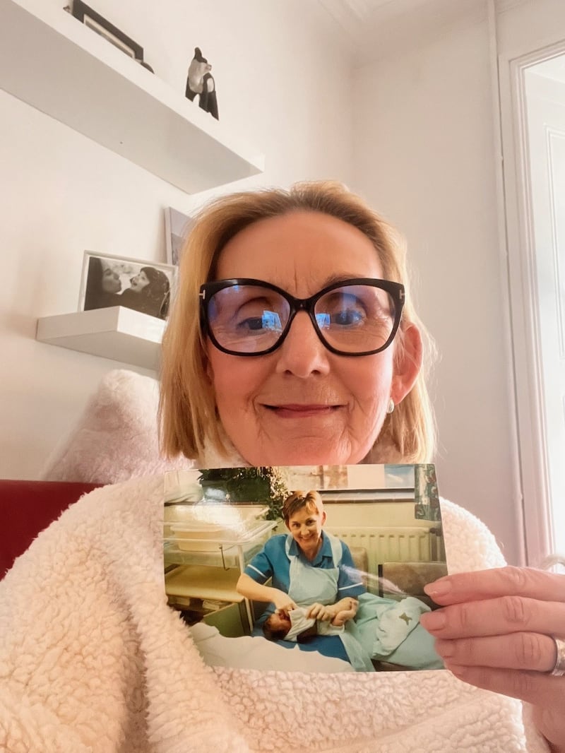 Ms Cooling holding a picture of her with Ms Wintle as a baby (Swansea Bay University Health Board)