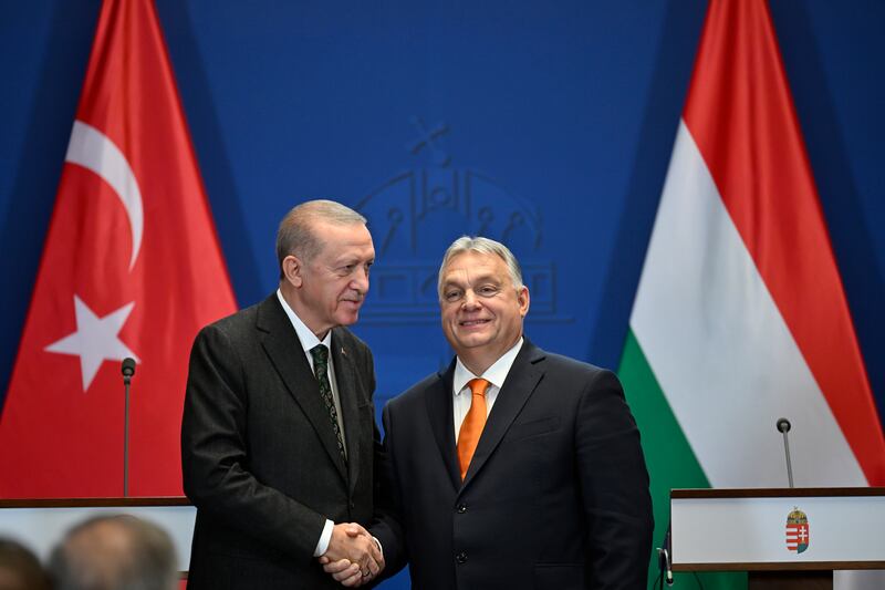 Turkey’s President Recep Tayyip Erdogan, left, and Hungary’s Prime Minister Viktor Orban shake hands after a joint statement at the Carmelite Monastery in Budapest, Hungary, on Monday (Denes Erdos/AP)