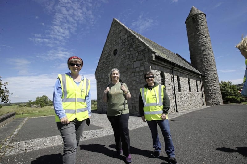 Irish language activist Linda Ervine yesterday launched a new St Patrick pilgrim walk in Downpatrick. She is pictured with pilgrim guides Martina Purdy left and Elaine Kelly. Picture: Hugh Russell 