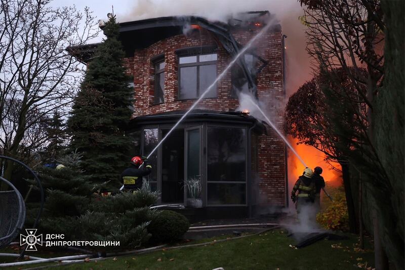 Rescue workers put out a fire after a Russian strike on Dnipro (Ukrainian Emergency Service via AP)