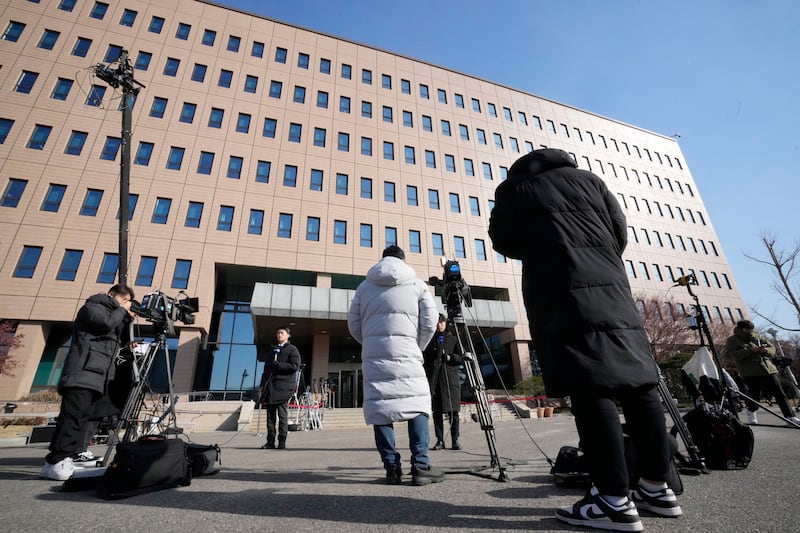 Media members wait for the arrival of impeached South Korean President Yoon Suk Yeol near the Corruption Investigation Office for High-ranking Officials in Gwacheon (Ahn Young-joon/AP)